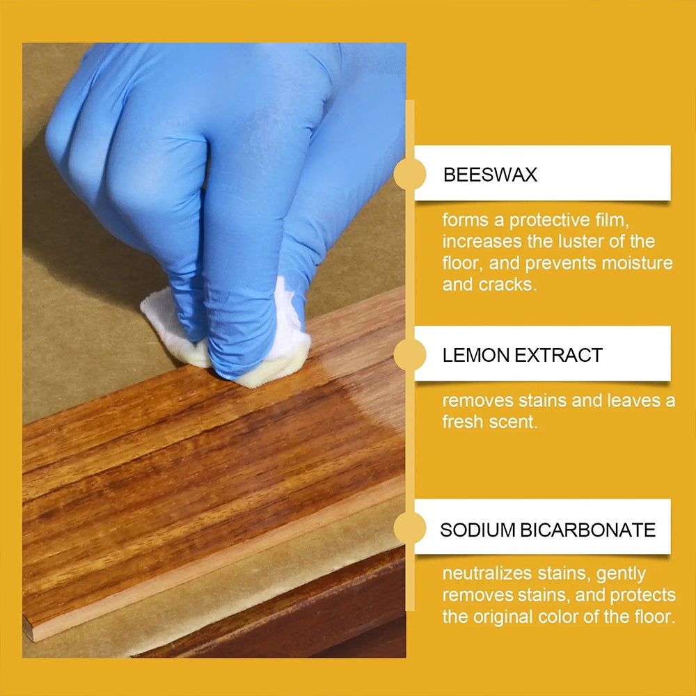 Wiping dark wooden surface with natural beeswax floor polish to clean and protect wood grain