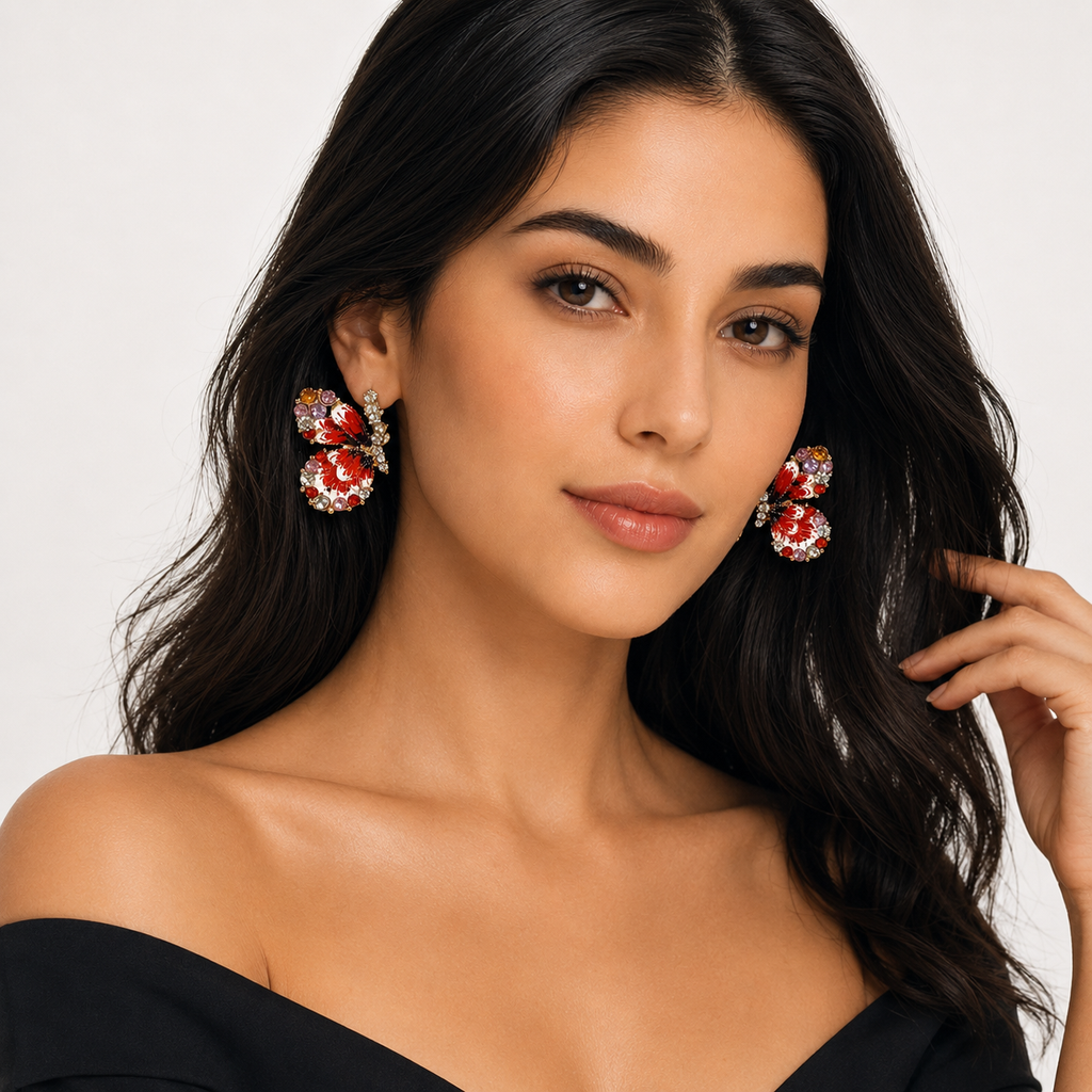 Model wearing red butterfly rhinestone earrings