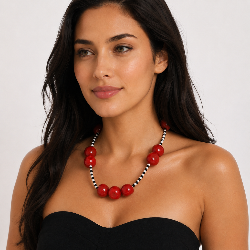 Model_wearing_bold_red_beaded_necklace_with_black_and_white_strand