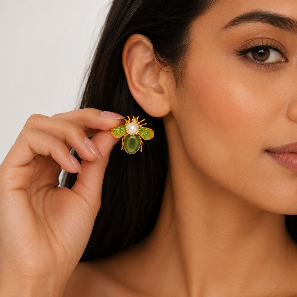 Model styling green and gold bee earrings